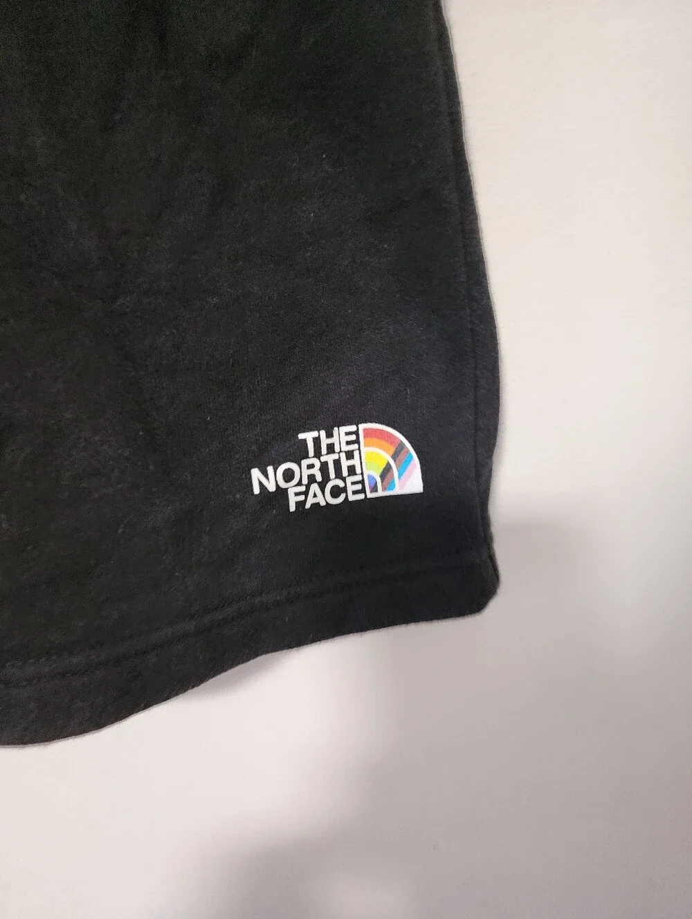 The North Face  Black Hoodie with Short Rainbow Logo
